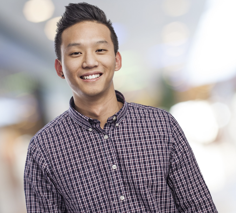 teen smiling after getting tooth extraction